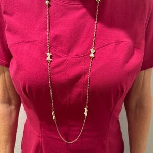 Elegant Gold Necklace with Pearl Bow Accents